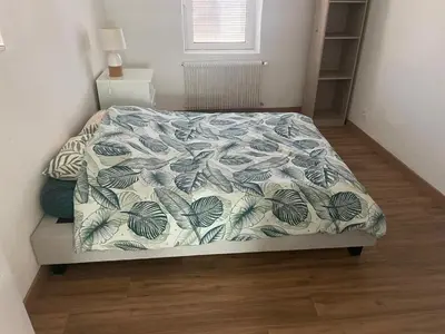 Un ou plusieurs lits dans un hébergement de l'établissement Appartement spacieux, proche centre ville