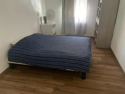 Un ou plusieurs lits dans un hébergement de l'établissement Appartement spacieux, proche centre ville