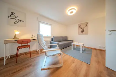 Coin salon dans l'établissement Beautiful apartment Near Basel 4 people Huningue