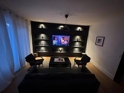Télévision ou salle de divertissement dans l'établissement Apartment de standing