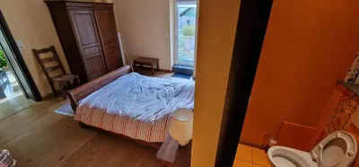 Un ou plusieurs lits dans un hébergement de l'établissement La Ferme des Cherierres - Piscine Intérieure Chauffée