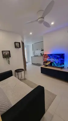 Télévision ou salle de divertissement dans l'établissement Le Malibu