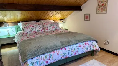 Un ou plusieurs lits dans un hébergement de l'établissement Le Chalet des 4 Chouettes