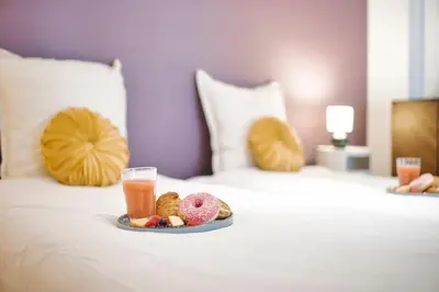Un ou plusieurs lits dans un hébergement de l'établissement The Purple Suite - Duplex - Mulhouse Center