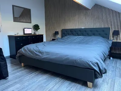 Un ou plusieurs lits dans un hébergement de l'établissement Le Tholy - 2 chambres avec canapé