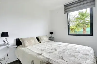 Un ou plusieurs lits dans un hébergement de l'établissement FAA'mily Home - 3 bedrooms