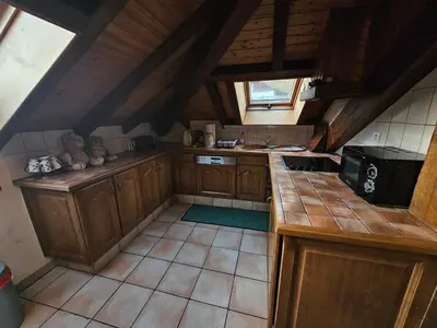 Cuisine ou kitchenette dans l'établissement appartement le petit chalet sauna