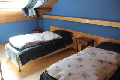Un ou plusieurs lits dans un hébergement de l'établissement Les huit joyeux randonneurs au sauna