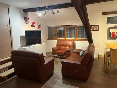 Coin salon dans l'établissement Duplex la rose rouge - 4 people