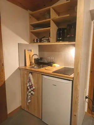 Cuisine ou kitchenette dans l'établissement La chambre d'hôtes du facteur d'orgues