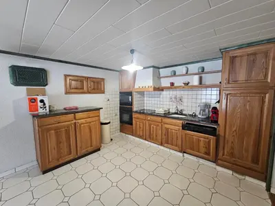 Cuisine ou kitchenette dans l'établissement le chant de la rivière