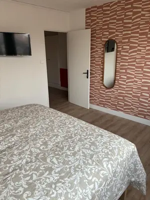 Un ou plusieurs lits dans un hébergement de l'établissement Chez nous Mulhouse - Hyper Centre - Parking - Balcon - Netflix