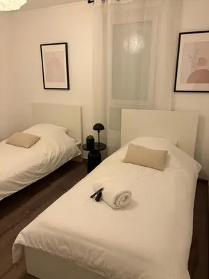 Un ou plusieurs lits dans un hébergement de l'établissement Bright Apartment 5 min from BASEL with Balcony & Free Private Parking