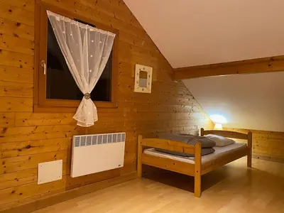 Un ou plusieurs lits dans un hébergement de l'établissement Chalet tout confort 1-7 personnes