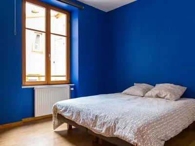 Un ou plusieurs lits dans un hébergement de l'établissement Apartment mit zwei Garagenstellplätzen by Interhome