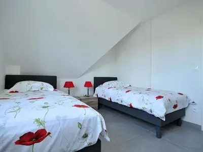 Un ou plusieurs lits dans un hébergement de l'établissement Maison familiale spacieuse, animaux acceptés à Oberentzen - FR-1-744-51