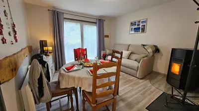 Coin salon dans l'établissement Maison avec terrain, proche du Ballon d'Alsace Gite des 2 lacs