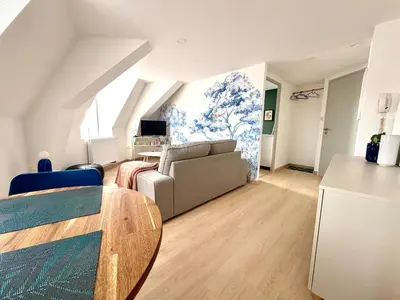Coin salon dans l'établissement Cozy Apartment city center