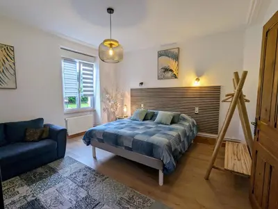 Un ou plusieurs lits dans un hébergement de l'établissement Chambres Eugène et Gabrielle, La Villa de Fraize