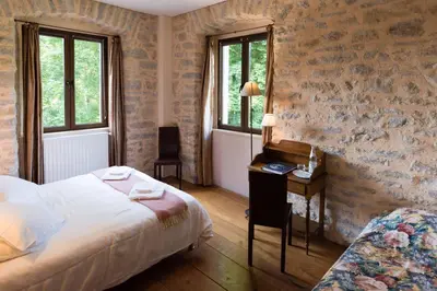 Un ou plusieurs lits dans un hébergement de l'établissement Hôtel le Morimont