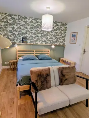 Un ou plusieurs lits dans un hébergement de l'établissement Le studio du rempart, appartement cosy au coeur de village