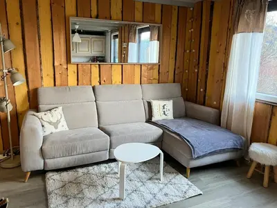 Coin salon dans l'établissement Cozy chalet in the Vosges with scenic views