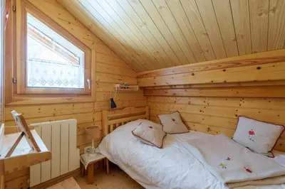 Un ou plusieurs lits dans un hébergement de l'établissement Les Gelinottes - Avec sauna privé