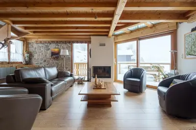 Coin salon dans l'établissement Les Gelinottes - Avec sauna privé