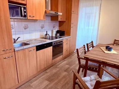 Cuisine ou kitchenette dans l'établissement Le Cosy Home