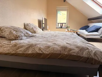 Un ou plusieurs lits dans un hébergement de l'établissement Appartement jacuzzi et spa étoile Mystérieuse