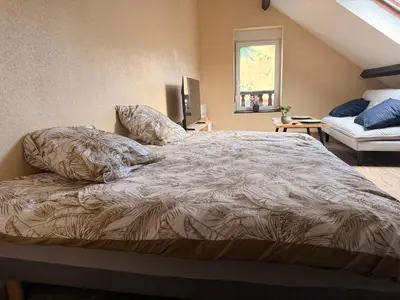 Un ou plusieurs lits dans un hébergement de l'établissement Appartement jacuzzi et spa étoile Mystérieuse