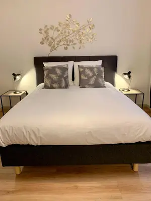Un ou plusieurs lits dans un hébergement de l'établissement Appartements des 2 Têtes