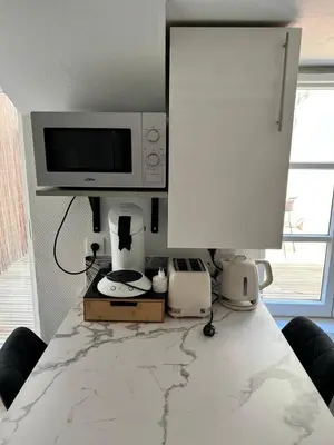 Télévision ou salle de divertissement dans l'établissement Montbel'appart Le Duplex avec Jardin et Terrasse