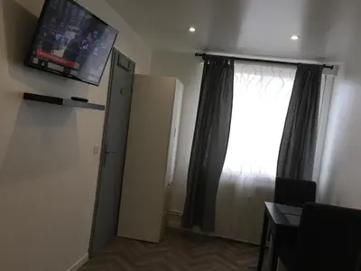 Télévision ou salle de divertissement dans l'établissement Cozy studio face Gare tgv Mulhouse