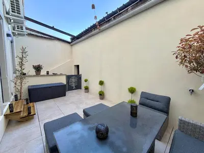 Coin salon dans l'établissement T2 design terrasse, Climatisé, Netflix
