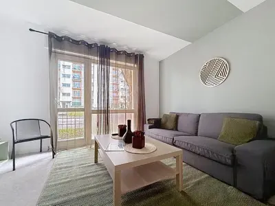 Coin salon dans l'établissement Appartement calme avec 2 chambres parking gratuit
