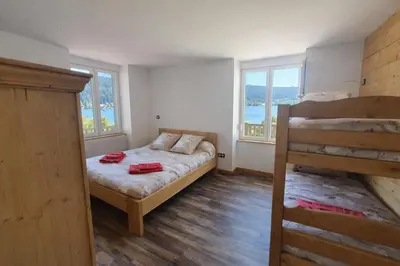 Un ou plusieurs lits dans un hébergement de l'établissement Chalet Blancneige