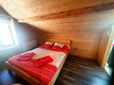 Un ou plusieurs lits dans un hébergement de l'établissement Chalet Blancneige