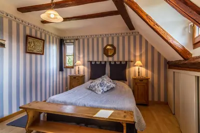 Un ou plusieurs lits dans un hébergement de l'établissement Maison Gîte Au Tonnelier
