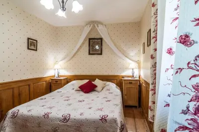 Un ou plusieurs lits dans un hébergement de l'établissement Maison Gîte Au Tonnelier