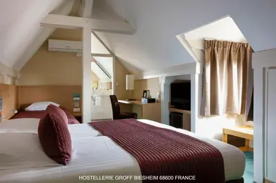 Un ou plusieurs lits dans un hébergement de l'établissement Aux Deux Clefs - Hôtel Restaurant Groff