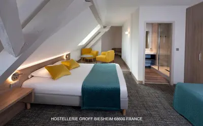 Un ou plusieurs lits dans un hébergement de l'établissement Aux Deux Clefs - Hôtel Restaurant Groff