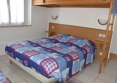 Un ou plusieurs lits dans un hébergement de l'établissement Hotel Gai Relais