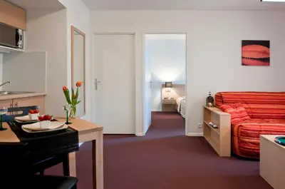 Un ou plusieurs lits dans un hébergement de l'établissement Aparthotel Adagio Access Saint Louis Bâle