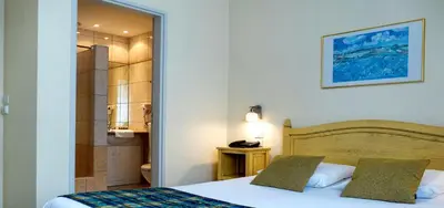 Un ou plusieurs lits dans un hébergement de l'établissement Hotel Berlioz EuroAirport Basel - Mulhouse - Freiburg