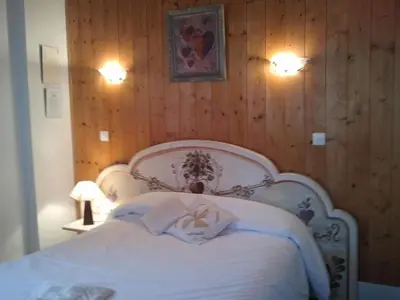 Un ou plusieurs lits dans un hébergement de l'établissement Hôtel La Vallée