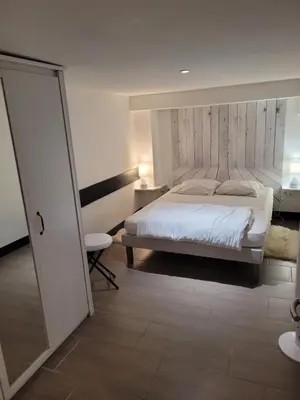 Un ou plusieurs lits dans un hébergement de l'établissement Tripiers Duplex