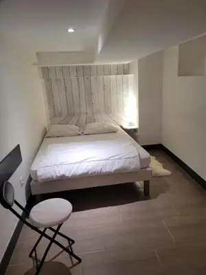 Un ou plusieurs lits dans un hébergement de l'établissement Tripiers Duplex