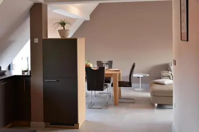 Coin salon dans l'établissement Gites Les Terrasses du Wineck