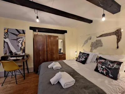 Un ou plusieurs lits dans un hébergement de l'établissement Maison Cliquot - Appartements Colmar Centre